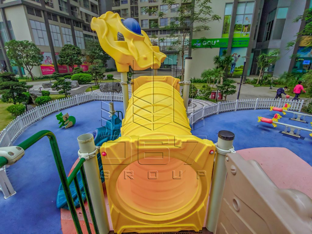 Apartment courtyard playground with slide and rubber safety surfacing